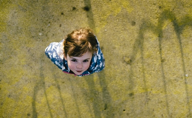 Overhead shot of a toddler looking up